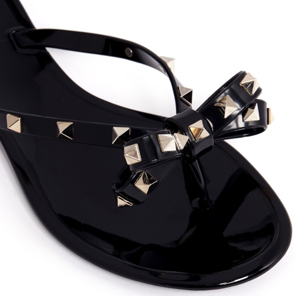 Black studded flip flops